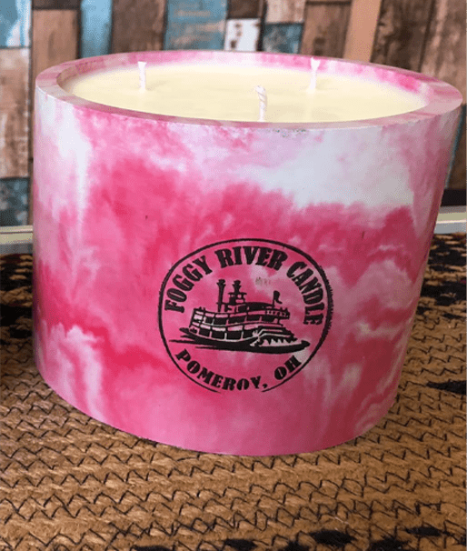 A marble pink, three-wick candle